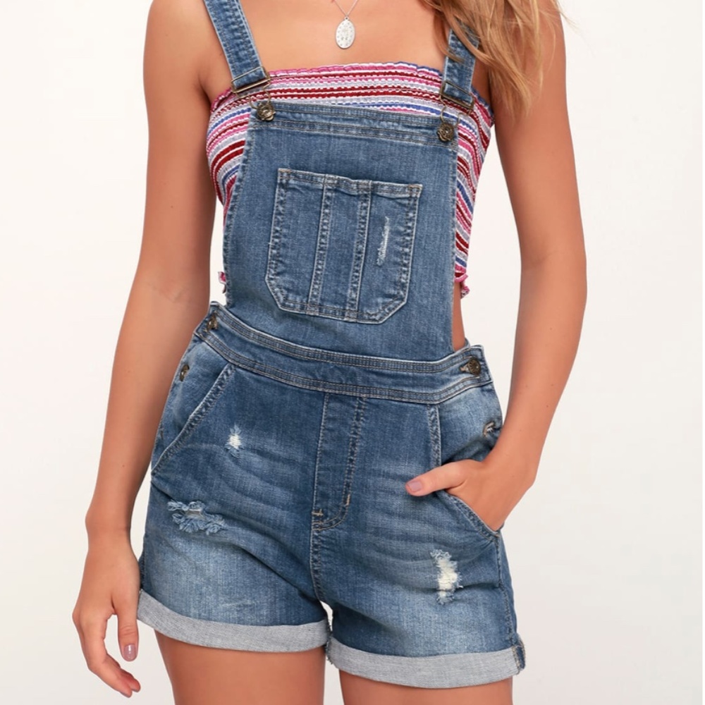 Medium wash distressed jean overalls